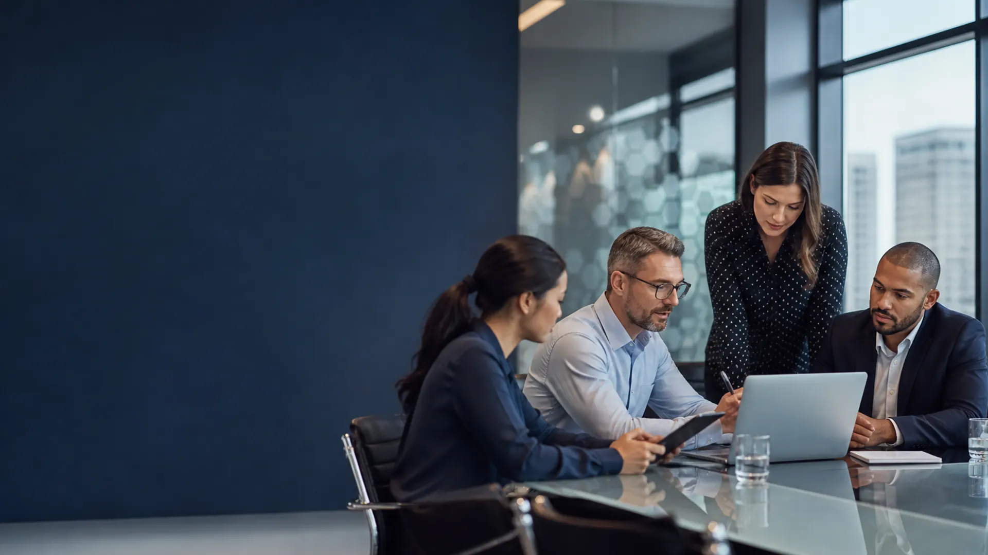 Professionals collaborating in a modern technology meeting